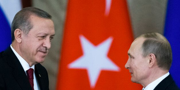 Russian President Vladimir Putin (R) shakes hands with his Turkish counterpart Tayyip Erdogan after the talks at the Kremlin in Moscow, Russia, March 10, 2017. REUTERS/Alexander Zemlianichenko/Pool TPX IMAGES OF THE DAY