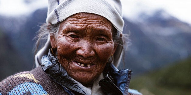 NAMCHE BAZAR, SOLU-KHUMBU - SEPTEMBER 21: Residents of the Himalayas live and work a hard life, this Sherpa woman walking a ridgeline trail on September 21, 2016 in Namche Bazar, Nepal. The trails in the Solu-Khumbu region of Nepal are stunning, winding their way through the highest mountain range on Earth all the way to the top of the top, Mt Everest. Trekkers from all over flock to the region every season to get their own view of the 8848m peak, but for locals living in the mountains these trails are a way of life, the veins of productivity between villages. Mountain workers haul everything up the peaks using yaks and their own back; food, supplies for teahouses, gear for trekking and climbing expeditions. It takes around 10 days just to get to Everest base camp, and a healthy tourism sector is vital for the region. On April 25, 2015 that all changed when Nepal was struck by a powerful 7.8 magnitude earthquake killing almost 9000 people. The damage extended from Kathmandu deep into the Khumbu region where an avalanche from nearby Pumori swept through Everest base camp, killing 22 climbers. Just 17 days later another 7.3 magnitude quake hit the region. It is the worst natural disaster to hit Nepal in over 80 years with an estimated damage bill of $10 billion USD, half of Nepal's GDP. Almost two years since the quake and the trails are still unusually quiet, teahouses have a couple of visitors but just as many staff. Adventure tourism has been battered with climbing and trekking clientele falling by around 50 per cent. With the trekking industry accounting for a $120 million boost to the economy, it is a big hit for one of the poorest countries in Southeast Asia. (Photo by Heath Holden/Getty Images)