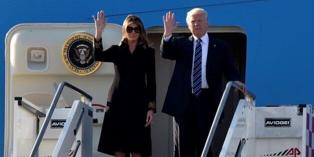 ROME, ITALY - MAY 23: U.S President Donald Trump (R) and his wife Melania Trump (L) gesture as they arrive at Fiumicino airport in Rome, Italy on May 23, 2017. (Photo by Alvaro Padilla/Anadolu Agency/Getty Images)