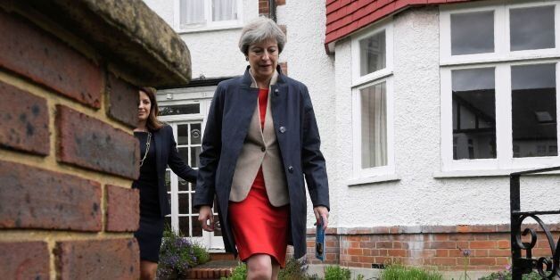 British Prime Minister Theresa May goes canvassing door to door with local Conservative candidate Joy Morrissey (L) in Ealing in west London on May 20, 2017, as campaigning continues in the build up to the general election on June 8. / AFP PHOTO / POOL / TOBY MELVILLE (Photo credit should read TOBY MELVILLE/AFP/Getty Images)