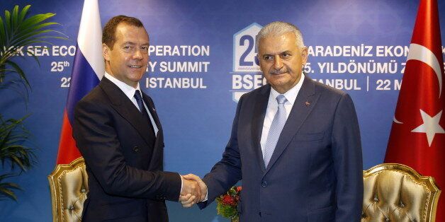 ISTANBUL, TURKEY - MAY 22, 2017: Russia's Prime Minister Dmitry Medvedev (L) and Turkey's Prime Minister Binali Yildirim shake hands as they meet on the sidelines of a summit of the Organization of the Black Sea Economic Cooperation (BSEC). Dmitry Astakhov/Russian Government Press and Information Office/TASS (Photo by Dmitry Astakhov\TASS via Getty Images)