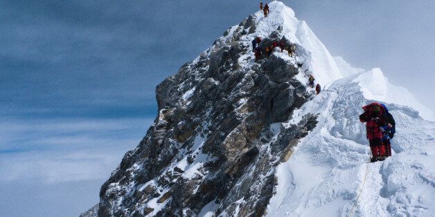 [UNVERIFIED CONTENT] Climbers descending the Hillary Step on Everest. Photo taken on the corniced ridge near the South Summit. Everest expedition 2010