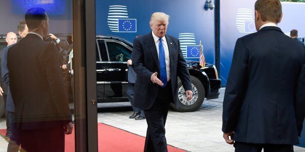US President Donald Trump (L) his welcomed by European Council President Donald Tusk (R) upon his arrival at the EU headquarters, as part of the NATO meeting, in Brussels, on May 25, 2017. / AFP PHOTO / THIERRY CHARLIER (Photo credit should read THIERRY CHARLIER/AFP/Getty Images)