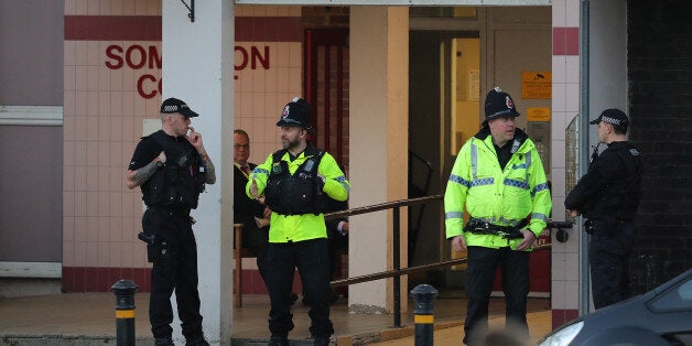 MANCHESTER, ENGLAND - MAY 24: Armed police stand outside a block of flats in Blackley, Greater Manchester, where a woman was arrested in connection with the Manchester Attack on May 24, 2017 in Manchester, England. An explosion occurred at Manchester Arena on the evening of May 22 as concert goers were leaving the venue after Ariana Grande had performed. Greater Manchester Police are treating the explosion as a terrorist attack and have confirmed 22 fatalities and 59 injured. (Photo by Christo