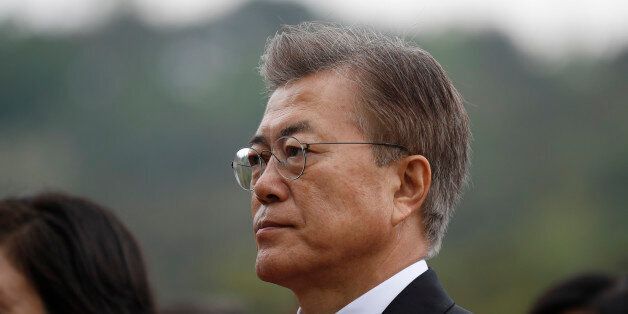 South Korea's President Moon Jae-in arrives at the National Cemetery in Seoul on May 10, 2017. Left-leaning former human rights lawyer Moon Jae-In began his five-year term as president of South Korea following a landslide election win after a corruption scandal felled the country's last leader. / AFP PHOTO / POOL / KIM HONG-JI (Photo credit should read KIM HONG-JI/AFP/Getty Images)