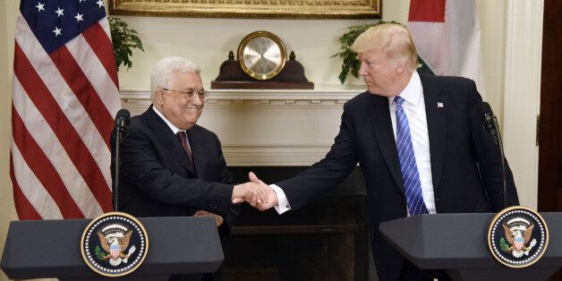 U.S. President Donald Trump shakes hands with Mahmoud Abbas, president of Palestine, left, during a joint press conference in the Roosevelt Room of the White House in Washington, D.C., U.S., on Wednesday, May 3, 2017. TrumpÂ welcomed AbbasÂ to the White House on Wednesday as the U.S. president weighs how to approach a Middle East conflict that has eluded resolution for seven decades. Photographer: Olivier Douliery/Pool via Bloomberg