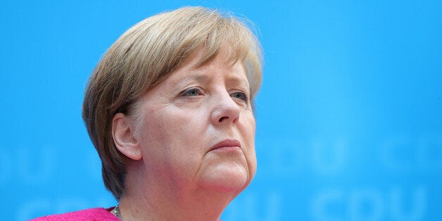 Angela Merkel, Germany's chancellor and leader of the Christian Democratic Union (CDU), looks on during a news conference at the CDU party headquarters in Berlin, Germany, on Monday, May 15, 2017. Merkel told reporters on Monday that her Christian Democratic Union won the vote in North Rhine-Westphalia on Sunday by focusing on local topics that mattered to voters such as internal security and improving the infrastructure. Photographer: Krisztian Bocsi/Bloomberg via Getty Images