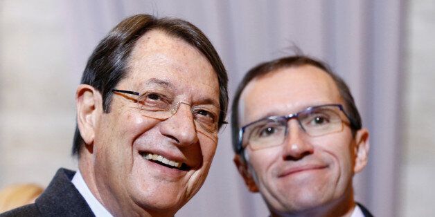 Cypriot President Nicos Anastasiades (L) arrives with U.N. special envoy Espen Barth Eide for the Cyprus reunification talks at the United Nations in Geneva, Switzerland January 9, 2017. REUTERS/Denis Balibouse