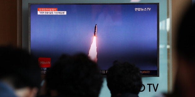 People watch a television screen showing a news broadcast on North Korea's ballistic missile launch at Seoul Station in Seoul, South Korea, on Sunday, May 14, 2017. North Korea fired a ballistic missile early Sunday, its seventh such test this year, just days after South Korea elected a president who vowed to engage with Kim Jong Un's regime to defuse tensions over its nuclear weapons program. Photographer: SeongJoon Cho/Bloomberg via Getty Images