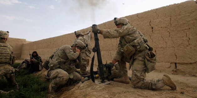 U.S. Army soldiers from 4-73 Cavalry Regiment, 82nd Airborne Division, fire a mortar during a firefight with Taliban while on a mission in Zhary district of Kandahar province, southern Afghanistan April 18, 2012. REUTERS/Baz Ratner (AFGHANISTAN - Tags: MILITARY CONFLICT)