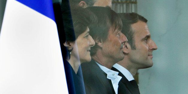 From L to R: Newly appointed French Minister of Armed Forces, Sylvie Goulard, Minister of the Ecological and Social Transition, Nicolas Hulot and French President Emmanuel Macron, pose for a family photo after the first cabinet meeting at the Elysee Palace in Paris, France, May 18, 2017. REUTERS/Charles Platiau