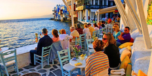 Tourists relaxing at Mykonos.