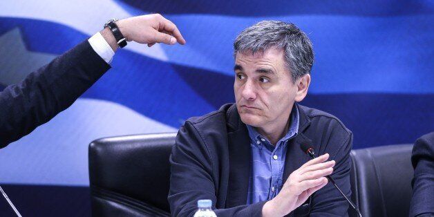 ATHENS, GREECE - MARCH 30: Greek Finance Minister Euclid Tsakalotos listens during a press conference on new measures taken against tax evasion at the Finance Ministry Building in Athens, Greece on March 30, 2017. (Photo by Ayhan Mehmet/Anadolu Agency/Getty Images)