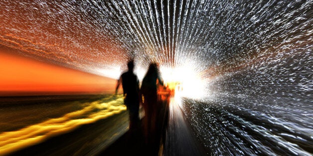 WASHINGTON, DC August 8, 2012 Brad Glatfelter (L) and Marie Pierce of Annandale, Va stand on the moving sidewalk the hallway between the East and West Buildings of the National Gallery of Art while experiencing Multiverse, a light sculpture, by American artist Leo Villareal. According to the National Gallery the work features approximately 41,000 computer-programmed LED (light-emitting diode) nodes that run through channels along the 200-foot-long space on August 8, 2012 in Washington, DC (Photo by Jonathan Newton/The Washington Post via Getty Images)