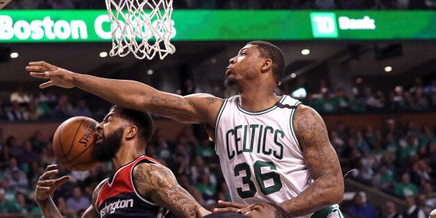 BOSTON - MAY 15: Boston Celtics guard Marcus Smart (36) and the Celtics defense put the clamps on Washington Wizards forward Markieff Morris (5) on this play during the third quarter. The Boston Celtics host the Washington Wizards in Game 7 of the Eastern Conference Semi-Finals at TD Garden in Boston on May 15, 2017. (Photo by Barry Chin/The Boston Globe via Getty Images)