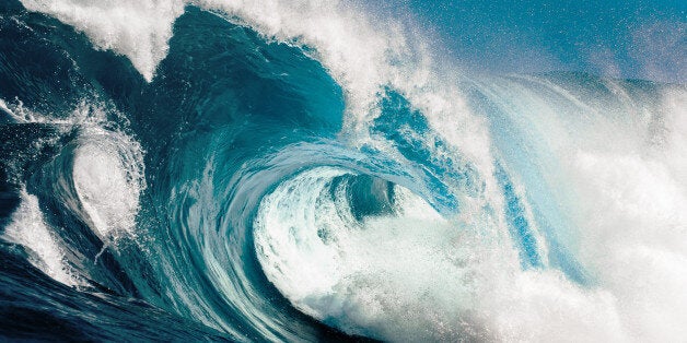 Looking in to the eye of a huge blue wave.