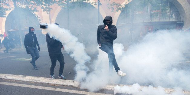 Demonstrators confront police on the annual May Day worker's march on May 1, 2017 in Paris, France. Police dealt with violent scenes in central Paris during the rally held close to the Place de la Bastille. The violent riot of the first may 2017, causing 6 policemen wounded may molotov coktail, and 5 protester arerested. (Photo by Julien Mattia/NurPhoto via Getty Images)