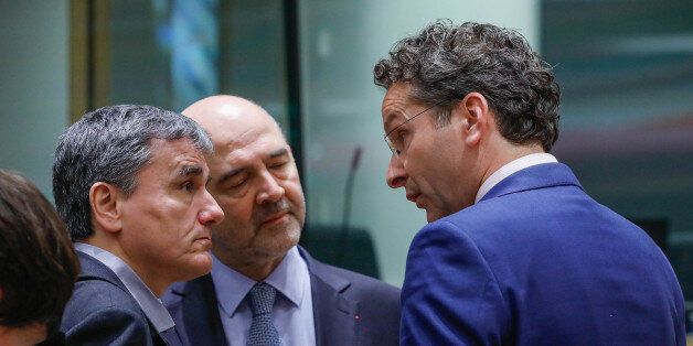 Greek Finance Minister Euclid Tsakalotos (L), European Economic and Financial Affairs Commissioner Pierre Moscovici (C) and Dutch Finance Minister and Eurogroup President Jeroen Dijsselbloem take part in a eurozone finance ministers meeting in Brussels, Belgium March 20, 2017. REUTERS/Yves Herman