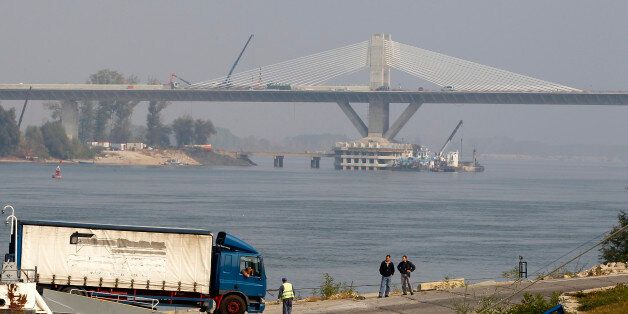 A truck leaves a ferryboat in front of the newly built bridge over Danube that links Calafat in Romania to Vidin in Bulgaria, 320 km southwest of Bucharest, October 24, 2012. Romania's infrastructure is the least developed in the European Union after years of repeated delays and is one of the main complaints of foreign investors, who say decrepit transport cancels out an advantageous location at a trading crossroads and relatively low labour costs. The Calafat-Vidin bridge should be open in six