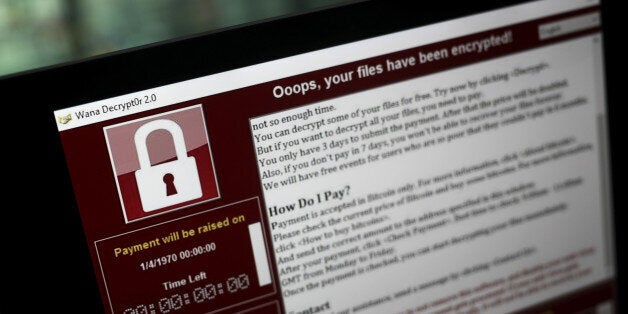 A lock screen from a cyber attack warns that data files have been encrypted on a laptop computer in this arranged photo in London, U.K., on Monday, May 15, 2017. Governments and companies around the world began to gain the upper hand against the first wave of an unrivaled globalÂ cyberattack, even as the assault was poised to continue claiming victims this week.Â Photographer: Simon Dawson/Bloomberg via Getty Images