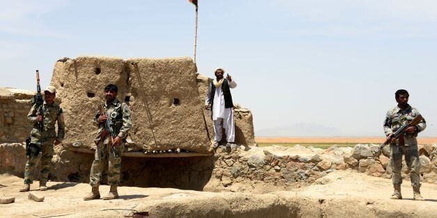 Afghan Border Police personnel keep watch during an ongoing battle between Pakistani and Afghan Border forces near the Durand line at Spin Boldak, in southern Kandahar province on May 5, 2017.Pakistani and Afghan officials have accused each other of killing civilians after gunfire erupted near a major border crossing where Pakistani census officials were carrying out a count, exacerbating tensions between the neighbours. / AFP PHOTO / JAVED TANVEER (Photo credit should read JAVED TANVEER/AFP/Getty Images)