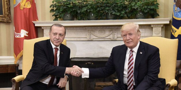 US President Donald Trump shakes hands with Turkish President Recep Tayyip Erdogan as he arrives for meetings at the White House in Washington, DC, May 16, 2017. / AFP PHOTO / SAUL LOEB (Photo credit should read SAUL LOEB/AFP/Getty Images)