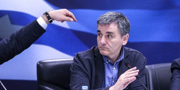 ATHENS, GREECE - MARCH 30: Greek Finance Minister Euclid Tsakalotos listens during a press conference on new measures taken against tax evasion at the Finance Ministry Building in Athens, Greece on March 30, 2017. (Photo by Ayhan Mehmet/Anadolu Agency/Getty Images)