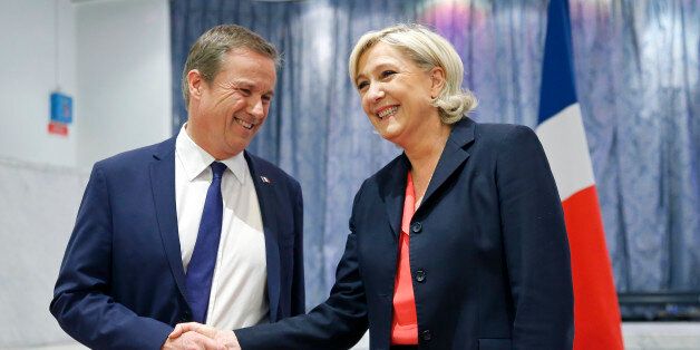 PARIS, FRANCE - APRIL 29: French presidential election candidate for the right-wing 'Debout la France' (DLF) party, Nicolas Dupont-Aignan (L), and French presidential election candidate for the far-right Front National (FN) party Marine Le Pen (R) shake hand at the end of a press conference on April 29, 2017 in Paris, France. Le Pen has announced that she will appoint Nicolas Dupont-Aignan as prime minister if she is elected president of the French republic. France will hold the second round of the presidential elections on May 07 2017. (Photo by Chesnot/Getty Images)