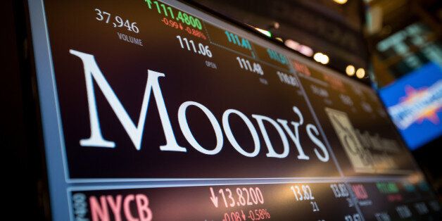 A monitor displays Moody's Corp. signage on the floor of the New York Stock Exchange (NYSE) in New York, U.S., on Monday, March 27, 2017. U.S. stocks fell, extending a decline on Friday after President Trump failed to pass his health-care bill, undermining optimism he can enact growth policies that invigorated bulls after the election. Photographer: Michael Nagle/Bloomberg via Getty Images