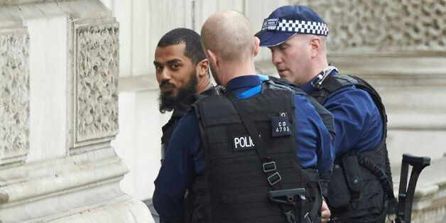 Firearms officiers from the British police detain a man on Whitehall near the Houses of Parliament in central London on April 27, 2017 before being taken away by police. Metropolitan police attended an incident on Whitehall in central London near the Houses of Parliament where one man was arrested, police said. / AFP PHOTO / Niklas HALLE'N (Photo credit should read NIKLAS HALLE'N/AFP/Getty Images)