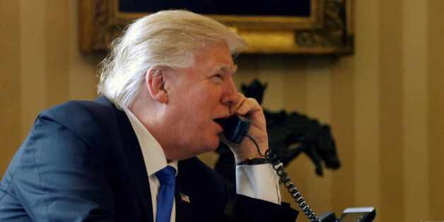 U.S. President Donald Trump speaks by phone with Russia's President Vladimir Putin in the Oval Office at the White House in Washington, U.S. January 28, 2017. REUTERS/Jonathan Ernst