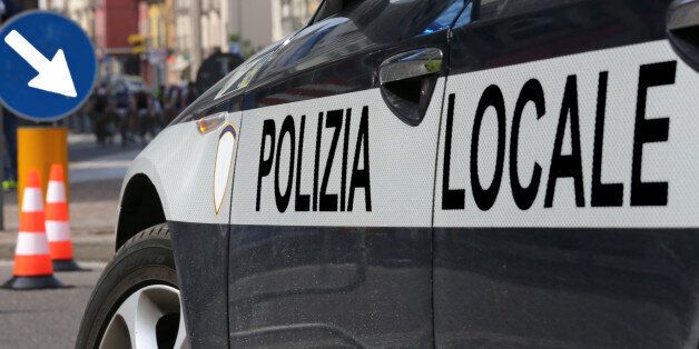 italian local police car during the roadblock in the road of the city