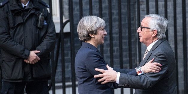 LONDON, ENGLAND - APRIL 26: Britain's Prime Minister, Theresa May, greets European Commission president, Jean-Claude Juncker, as he arrives at 10 Downing Street on April 26, 2017 in London, England. Prime Minister May is to hold her first major talks with E.U leaders since calling a general election in a bid to strengthen her position in forthcoming Brexit negotiations. (Photo by Carl Court/Getty Images)