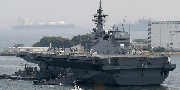 Japan's Maritime Self Defense Forces helicopter carrier Izumo sails out its Yokosuka Base in Kanagawa prefecture on May 1, 2017. Japan on May 1 dispatched its biggest warship since World War II to protect a US supply ship, one of the country's military roles expanded under Prime Minister Shinzo Abe, as tensions mount in the region over North Korea. / AFP PHOTO / JIJI PRESS / STR / Japan OUT (Photo credit should read STR/AFP/Getty Images)