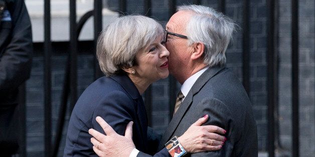 European Commission President, Jean-Claude Juncker (R) is greeted by British Prime Minister Theresa May outside 10 Downing Street in London on April 26, 2017.May hosts European Commission President Jean-Claude Juncker and chief negotiator Michel Barnier at Downing Street for the first face-to-face talks since she triggered the two-year process of withdrawing from the European Union. The encounter over dinner comes as the EU has toughened its strategy, making new demands over financial services, immigration and the bills Britain must settle before ending its 44-year-old membership in the bloc. / AFP PHOTO / Justin TALLIS (Photo credit should read JUSTIN TALLIS/AFP/Getty Images)