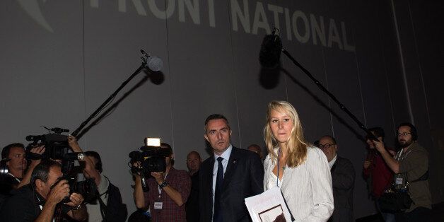 French Front National (FN) far-right party's deputy Marion Marechal-Le Pen (L) and FN's candidate for Marseille's town hall Stephane Ravier attend the FN summer congress on September 14, 2013 in Marseille, southern France. AFP PHOTO / BERTRAND LANGLOIS (Photo credit should read BERTRAND LANGLOIS/AFP/Getty Images)