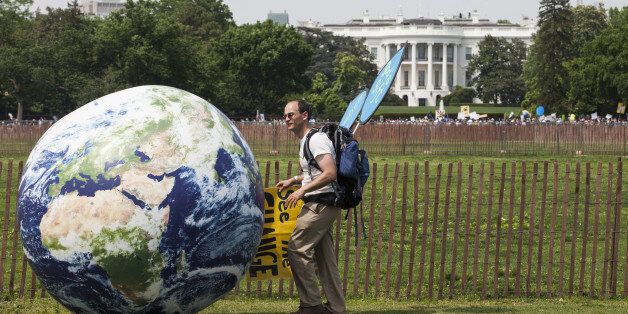 A demonstrator rolls a large globe outside of the White House during the People's Climate Movement March in Washington, D.C., U.S., on Saturday, April 29, 2017. Coinciding with U.S. President Donald Trump's 100th day in office, the People's Climate Movement March seeks to bring attention to and strengthen climate reform in the context of the Trump Administration cuts to environmental policy. Photographer: Zach Gibson/Bloomberg via Getty Images