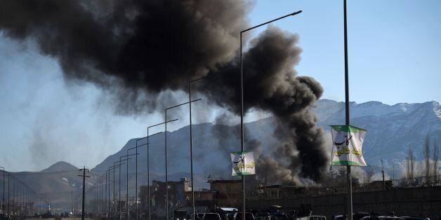 Smoke rises from an Afghan police district headquarters building after a suicide car bomb attack as a gun battle between Taliban and Afghan security forces continues in Kabul on March 1, 2017.Explosions and gunfire echoed through Kabul after near simultaneous Taliban suicide assaults on two security compounds, as the insurgents ramp up attacks even before the start of their annual spring offensive. / AFP / WAKIL KOHSAR (Photo credit should read WAKIL KOHSAR/AFP/Getty Images)
