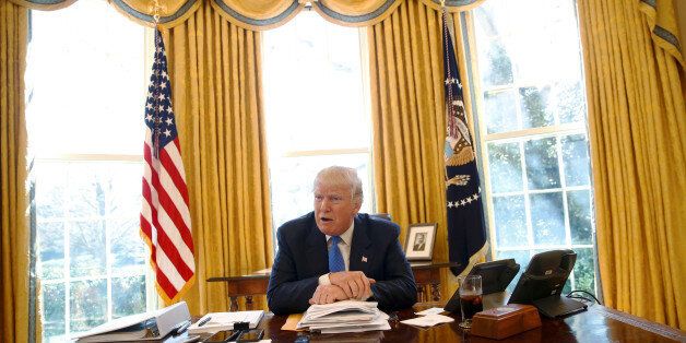 U.S. President Donald Trump gives an interview from his desk in the Oval Office at the White House in Washington, U.S., February 23, 2017. REUTERS/Jonathan Ernst TPX IMAGES OF THE DAY