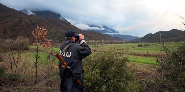 An Albanian police officer patrols at the Albanian-Greek border in Carshove near the city of Permet on March 15, 2016.EU interior ministers were set to meet in Brussels on March 17, 2016 to discuss the migrant crisis after western Balkan nations slammed shut their borders, exacerbating a dire humanitarian situation on the Macedonian frontier. Along with Bulgaria, others concerned include Italy, worried not only about a possible new influx of migrants from lawless Libya but also about people arri