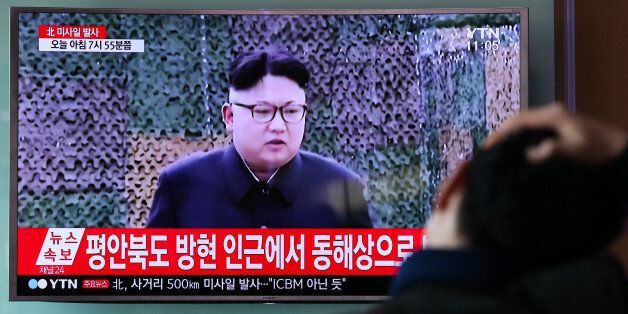 A man watches a television screen showing showing an image of Kim Jong Un, leader of North Korea during a news broadcast on North Korea's unidentified ballistic missile launch at Seoul Station in Seoul, South Korea, on Sunday, Feb. 12, 2017. North Korea fired an unidentified ballistic missile into nearby seas on Sunday, its first provocation since U.S. President Donald Trump took office. Photographer: SeongJoon Cho/Bloomberg via Getty Images