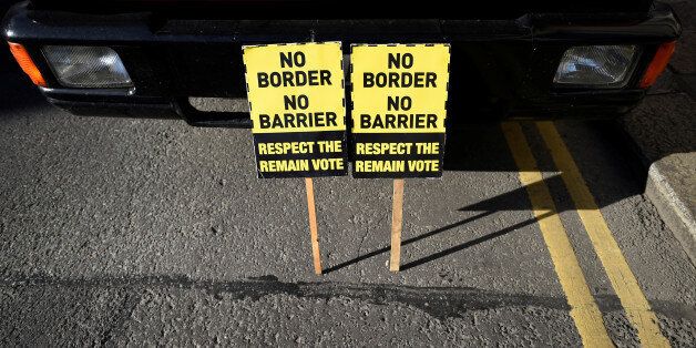 Protest signs left by anti-Brexit campaigners, Borders Against Brexit are left outside Irish Government buildings in Dublin, Ireland April 25, 2017. REUTERS/Clodagh Kilcoyne