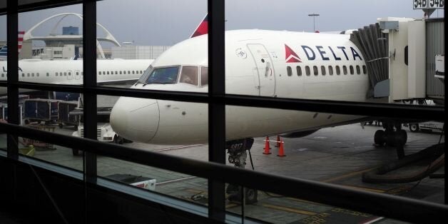 A passengers waits for a Delta Airlines flight in Terminal 5 at Los Angeles International Airport, May 4, 2017 in Los Angeles, California.In yet another incident that could prove a public relations nightmare for the airline industry, a California couple has come forward claiming they were kicked off an overbooked Delta flight for refusing to give up their child's seat. The incident unfolded last week as the Schear family of Huntington Beach were flying back home from Hawaii to Los Angeles. / AFP