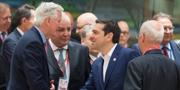 Michel Barnier, chief Brexit negotiator for the European Union (EU), left, greets Alexis Tsipras, Greece's prime minister, prior to a round table meeting during a European Union (EU) leaders emergency Brexit summit at the Europa building in Brussels, Belgium, on Saturday, April 29, 2017. European Union leaders headed into their first Brexit summit are convinced that when it comes to the pending talks with the U.K. theyre already winning. Photographer: Jasper Juinen/Bloomberg via Getty Images