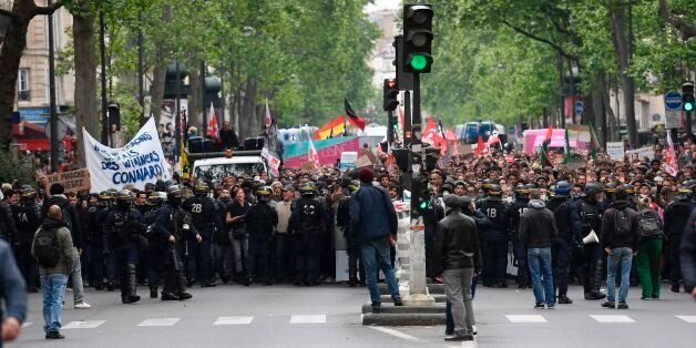 Riot police officers block a street while people take part in a demonstration called by the collectif 'Front Social' and labour unions on May 8, 2017 a day after the French presidential election. / AFP PHOTO / Lionel BONAVENTURE (Photo credit should read LIONEL BONAVENTURE/AFP/Getty Images)