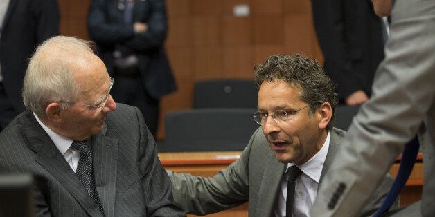 Wolfgang Schauble, Germany's finance minister, left, speaks with Jeroen Dijsselbloem, Dutch finance minister and head of the group of euro-area finance ministers, ahead of roundtable talks during a Eurogroup meeting in Brussels, Belgium, on Monday, May 9, 2016. The euro area and the International Monetary Fund will assess whether Greek Prime Minister Alexis Tsipras has made enough budget-tightening commitments to gain another disbursement of emergency loans. Photographer: Jasper Juinen/Bloomberg