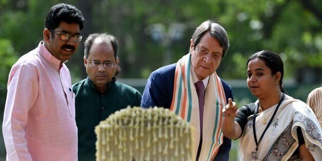Cypriot President Nicos Anastasiades (C) visits Gandhi Smriti, a museum dedicated to Indian independence icon Mahatma Gandhi, in New Delhi on April 27, 2017.President Anastasiades is on a state visit to India from April 25-29. / AFP PHOTO / MONEY SHARMA (Photo credit should read MONEY SHARMA/AFP/Getty Images)