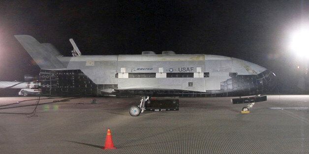 The X-37B Orbital Test Vehicle sits on the runway during post-landing operations Dec. 3, 2010, at Vandenberg Air Force Base, Calif. The X-37B conducted on-orbit experiments for more than 220 days during its maiden voyage. It fired its orbital maneuver engine in low-earth orbit to perform an autonomous reentry before landing. (U.S. Air Force photo/Michael Stonecypher) (Photo by DoD/Corbis via Getty Images)