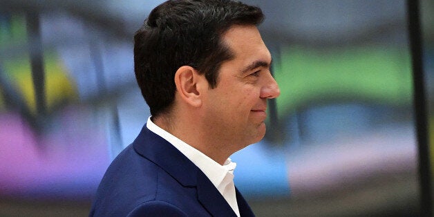 Greek Prime Minister Alexis Tsipras looks on during a special EU leaders' meeting at the Europa building, the main headquarters of European Council and the Council of the EU, in Brussels, on April 29, 2017.The 27 ?EU leaders hold a summit to adopt Brexit negotiating guidelines. EU President Donald Tusk urged the bloc to keep a united front at a special Brexit summit in Brussels, saying it will also help Britain if they can reach a deal. / AFP PHOTO / EMMANUEL DUNAND (Photo credit should r