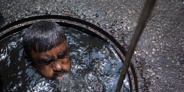 DHAKA, BANGLADESH - MAY 03 : A sewer cleaner of Dhaka City Corporation cleaning out the city's sewers on May 03, 2017 in Dhaka, Bangladesh. Despite a rise in the number of deaths of manhole workers every year, workers regularly go into the manholes without any protective gear.PHOTOGRAPH BY Zakir Chowdhury / Barcroft ImagesLondon-T:+44 207 033 1031 E:hello@barcroftmedia.com -New York-T:+1 212 796 2458 E:hello@barcroftusa.com -New Delhi-T:+91 11 4053 2429 E:hello@barcroftindia.com www.barcroftimages.com (Photo credit should read Zakir Chowdhury/Barcroft Images / Barcroft Media via Getty Images)
